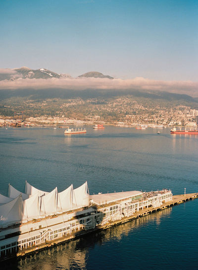 High angle view of boats in sea against sky