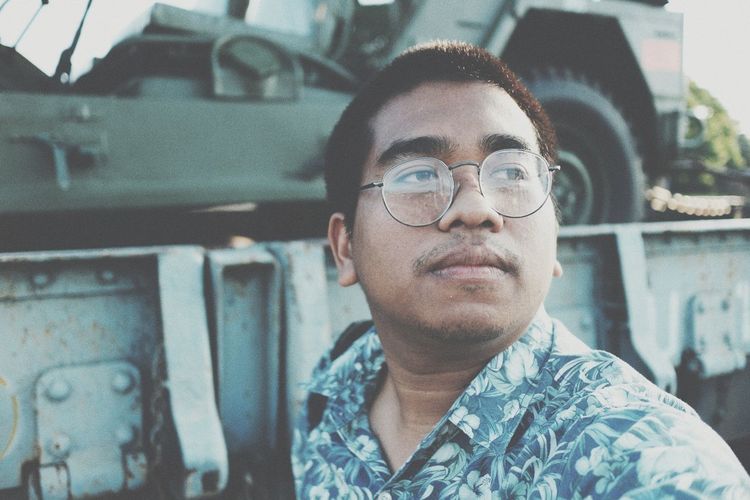 Man wearing eyeglasses looking away