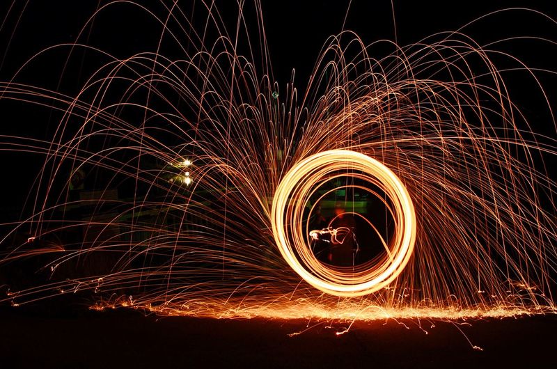 Man performing with wire wool at night