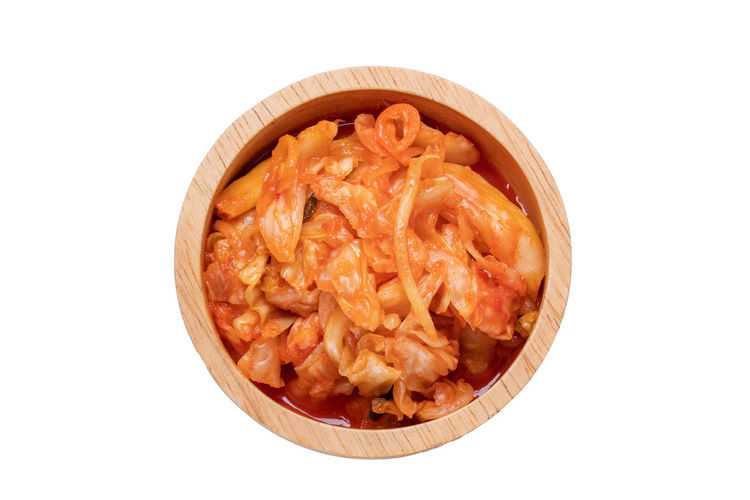 Directly above shot of pasta in bowl against white background