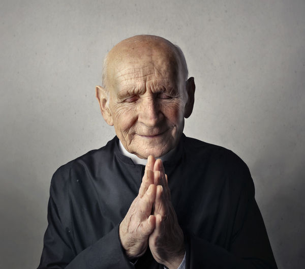 Portrait of priest in prayer