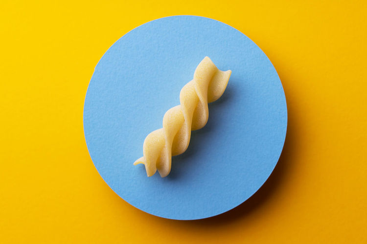 Close-up of cookies against yellow background