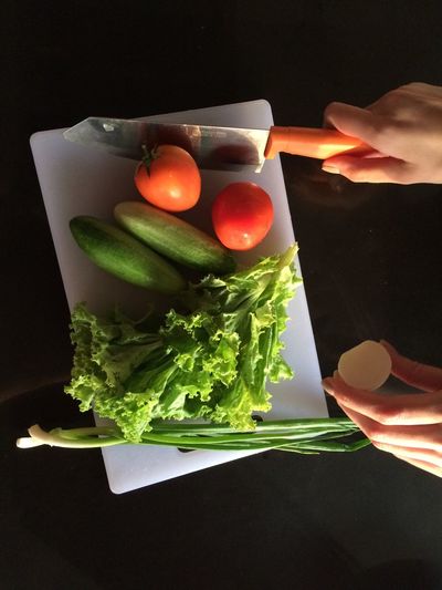 Close-up of hand holding vegetables