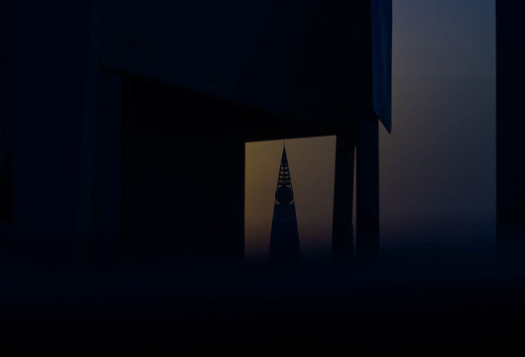 View of tower in city during dusk