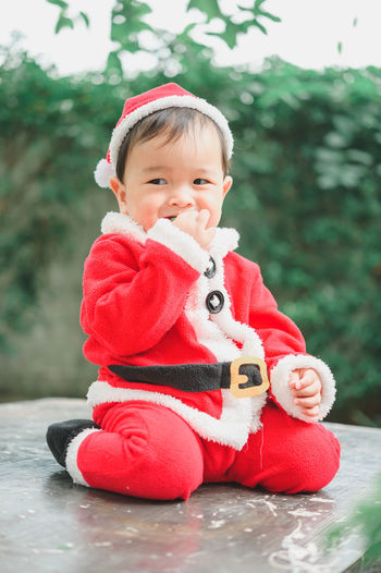 Portrait of cute baby girl looking away