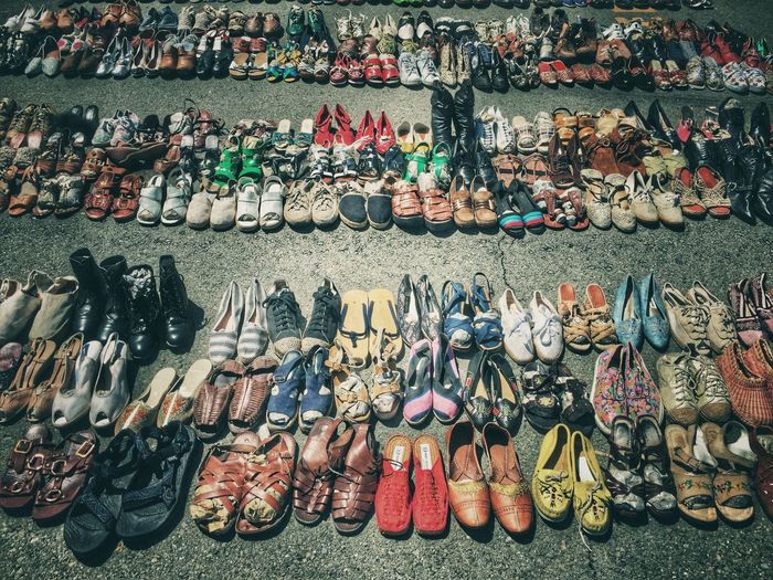 High angle view of footwear for sale at street market on sunny day