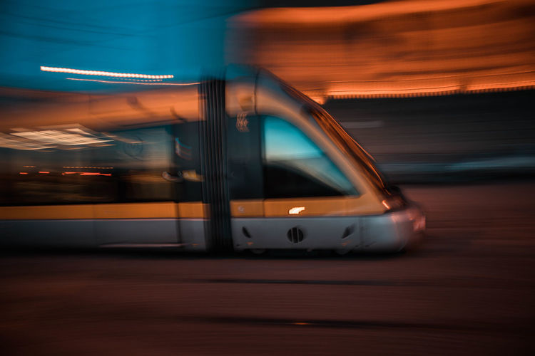 Blurred motion of car on road at night