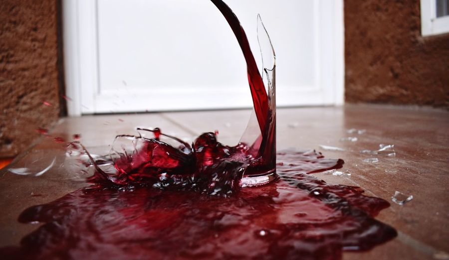 Close-up of wine splashing on table