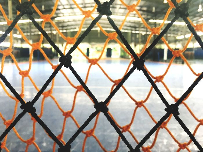 Close-up of chainlink fence against sky