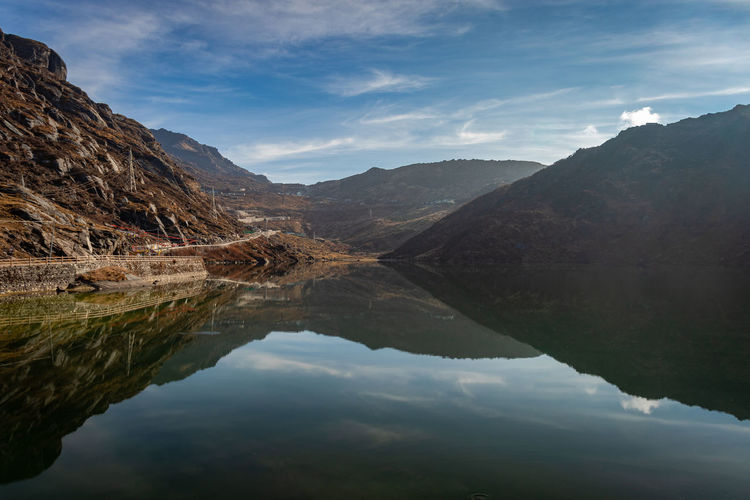 Pristine lake surrounded by himalayan mountain with pristine water reflection isolated view