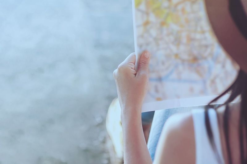 Close-up of woman holding map