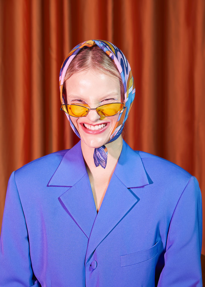 PORTRAIT OF A SMILING YOUNG WOMAN WEARING MASK