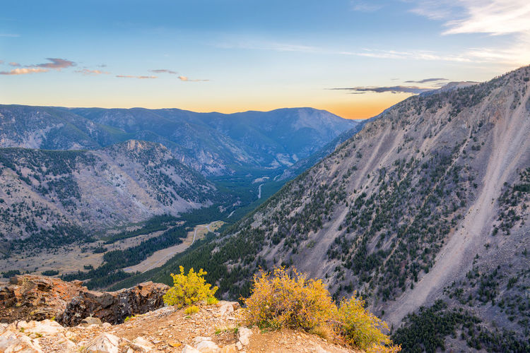 Scenic view of beartooth mountains against sky at yellowstone national park