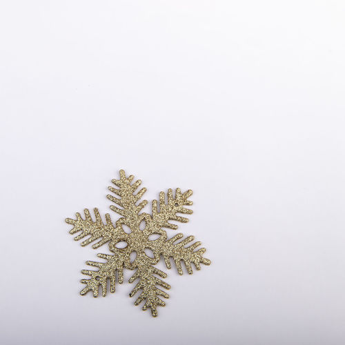 Low angle view of christmas tree against white background
