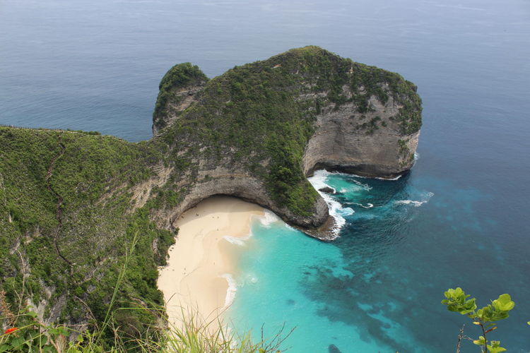High angle view of rocky island on sea