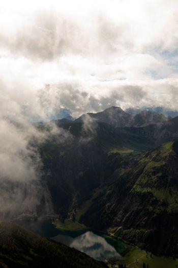 Aerial view of clouds over mountains