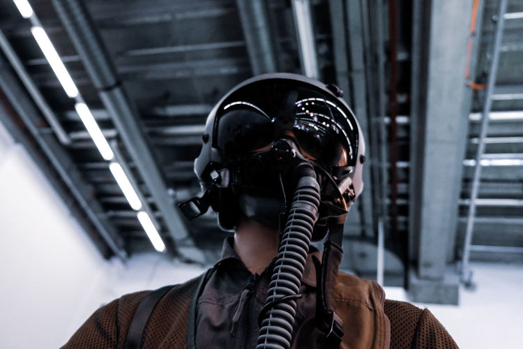 Man wearing gas mask indoor