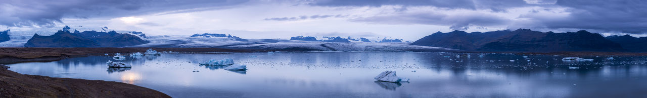 Panoramic view of lake against sky during winter