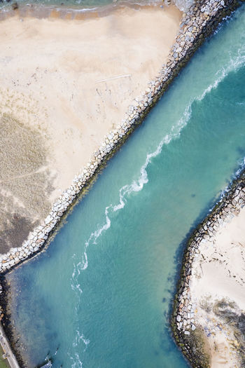 Aerial view of a breachway and beach in new england