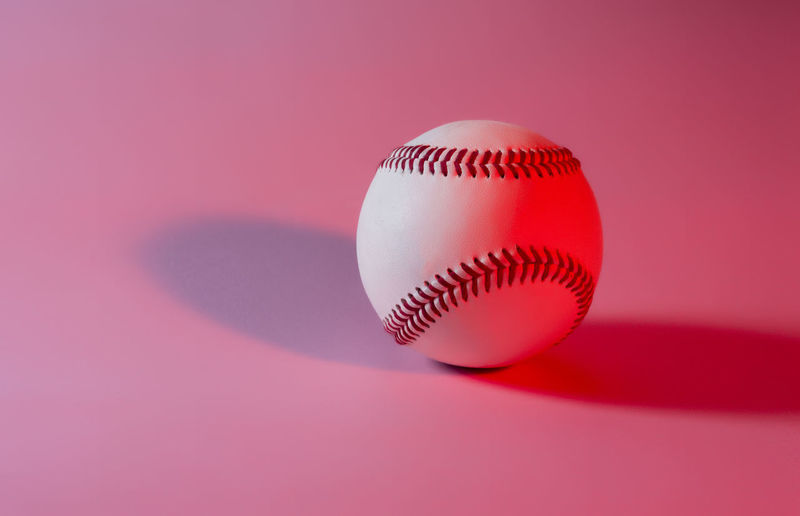 Close-up of ball against pink background