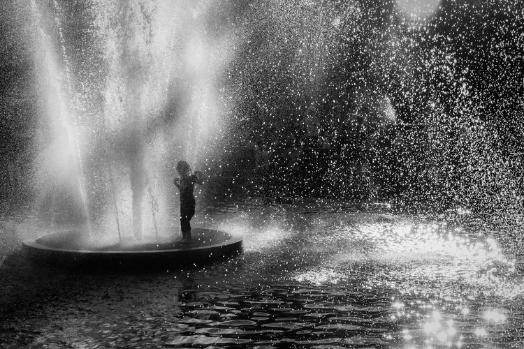 Girl enjoying fountain at washington square park
