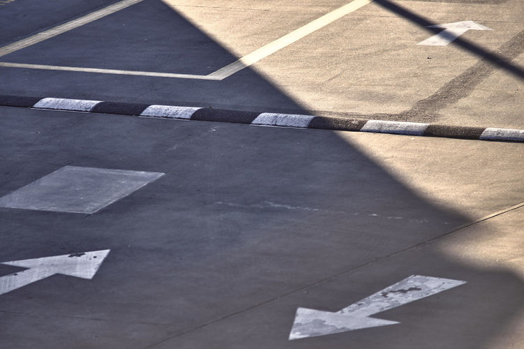High angle view of speed bump on road in city