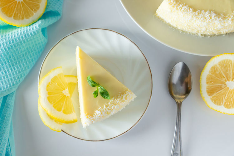 Lemon cake with mint and coconut on plate