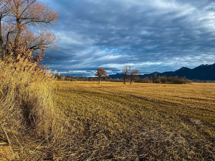 Scenic view of field against stormy and cloudy sky at murnauer moos, upper bavaria