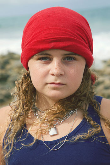 Portrait of young woman in hat