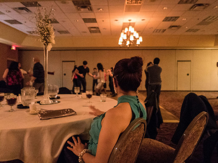 Woman looking at people dancing in party