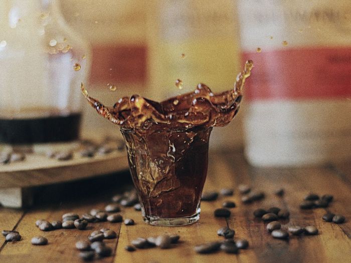 Close-up of drink splashing on table