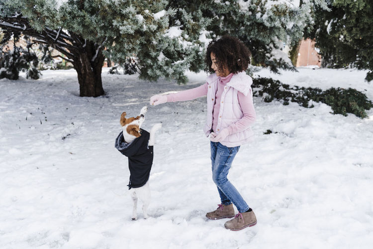 Children playing in snow during winter