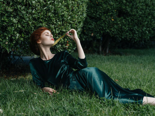 Young woman relaxing on field