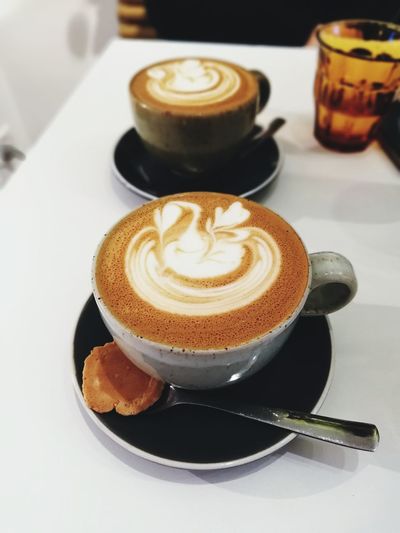 Close-up of coffee cup on table