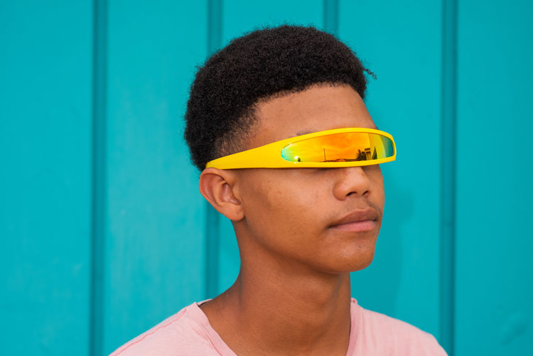 Close-up teenager boy wearing sunglasses outdoors