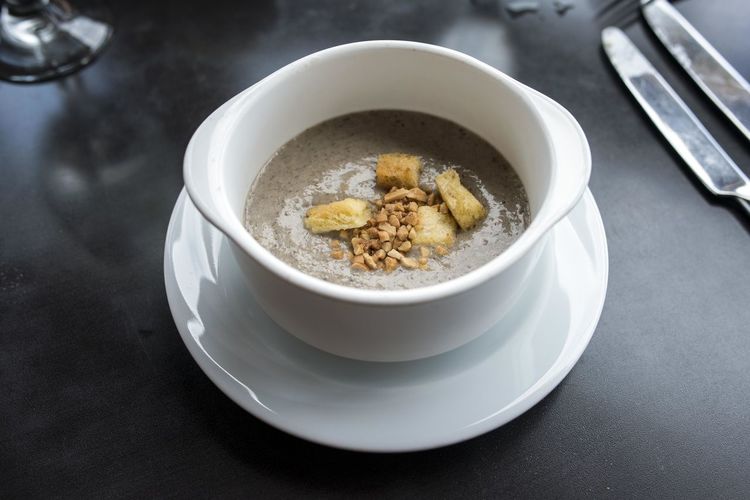 Thick creamy soup with bread crumb croutons