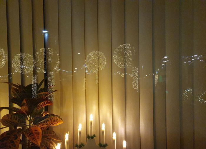 Illuminated christmas decoration in glass at night
