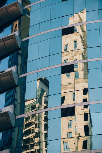 Low angle view of modern buildings against clear sky