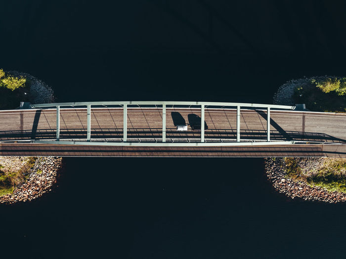 Aerial view of bridge over river during sunny day