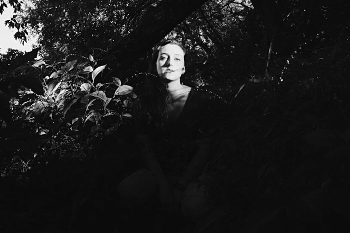 Portrait of woman amidst plants