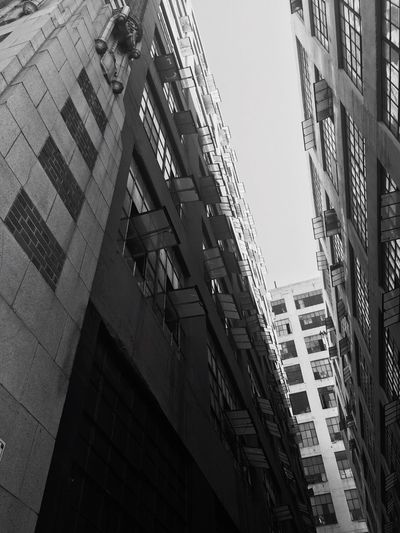Low angle view of skyscraper against clear sky