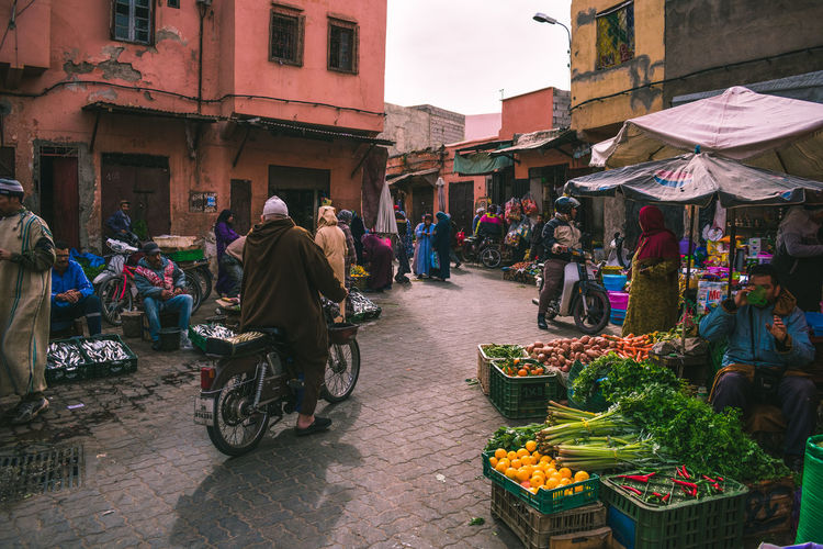 People at food market in islamic africa, marrakesh, morocco
