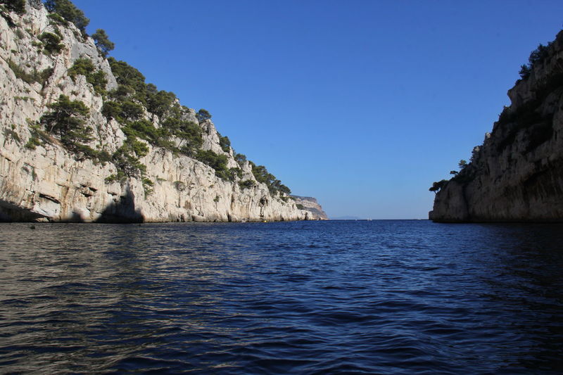 Scenic view of sea against clear blue sky