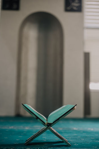 Close-up of metallic structure on table in building