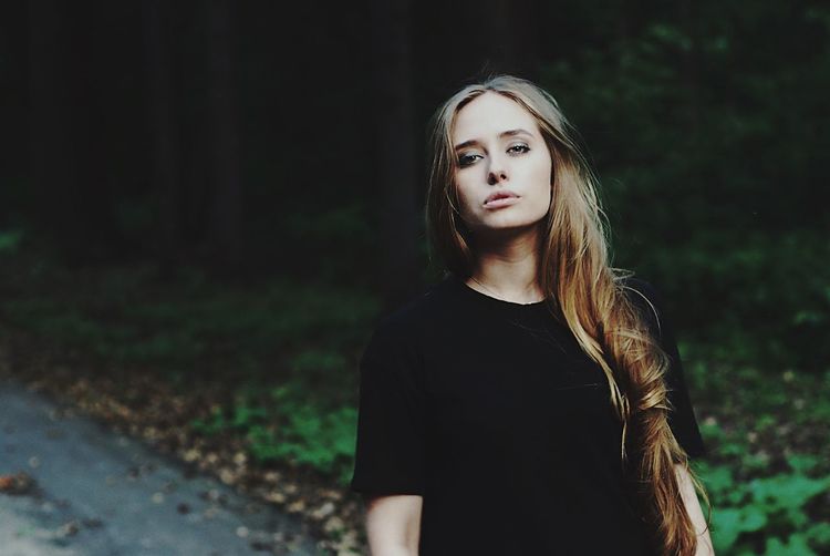 Portrait of beautiful woman in forest