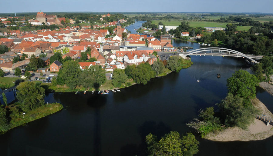 High angle view of river amidst buildings in town
