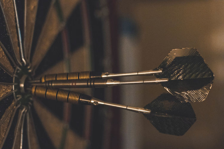 Close-up of arrows on dartboard