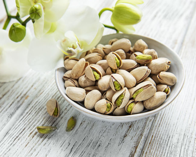 High angle view of almonds in bowl on table