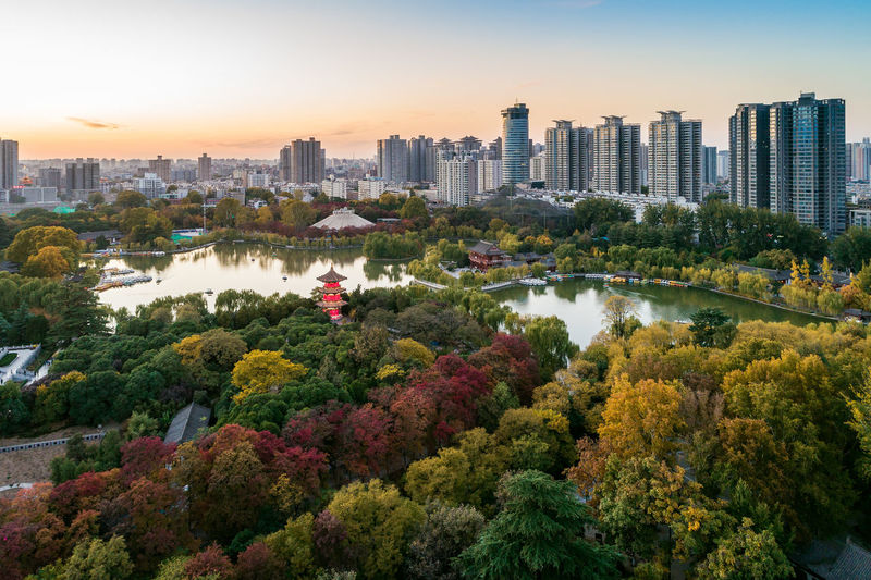 High angle view of trees and buildings against sky