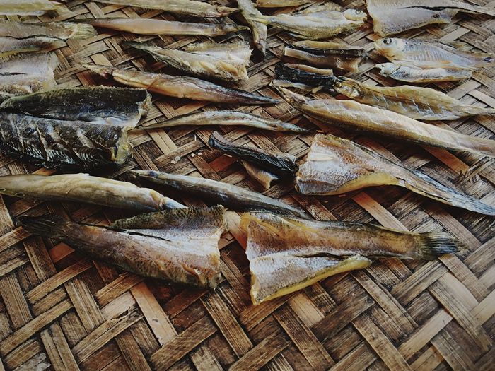 High angle view of dried fish on wicker